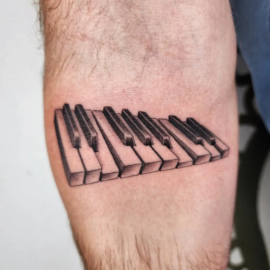 Medium Black and Grey Piano Keys Music Tattoo on Men Arm by @lwoodstattoo