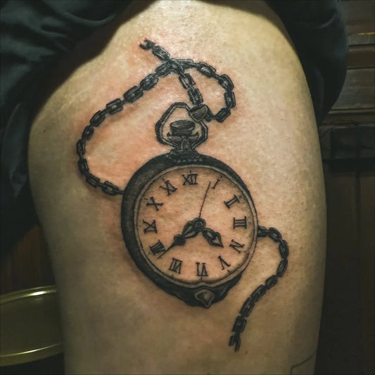 Medium Black and Grey Pocket Watch with Chain Tattoo on Men Thigh by @needenink