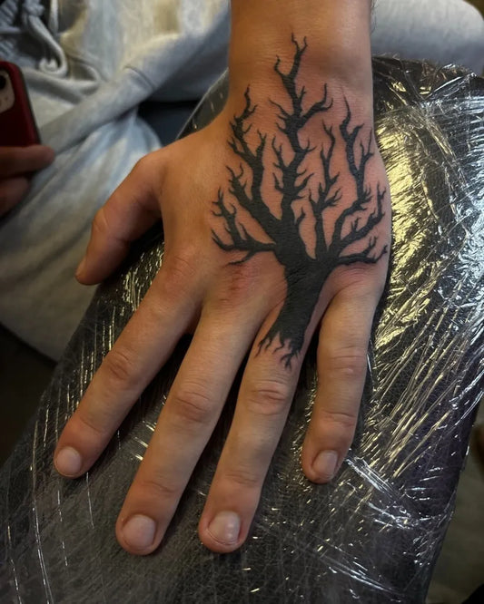 Medium Black and Grey Poison Tree on Men Hand Tattoo by @justpokeitstudioinc