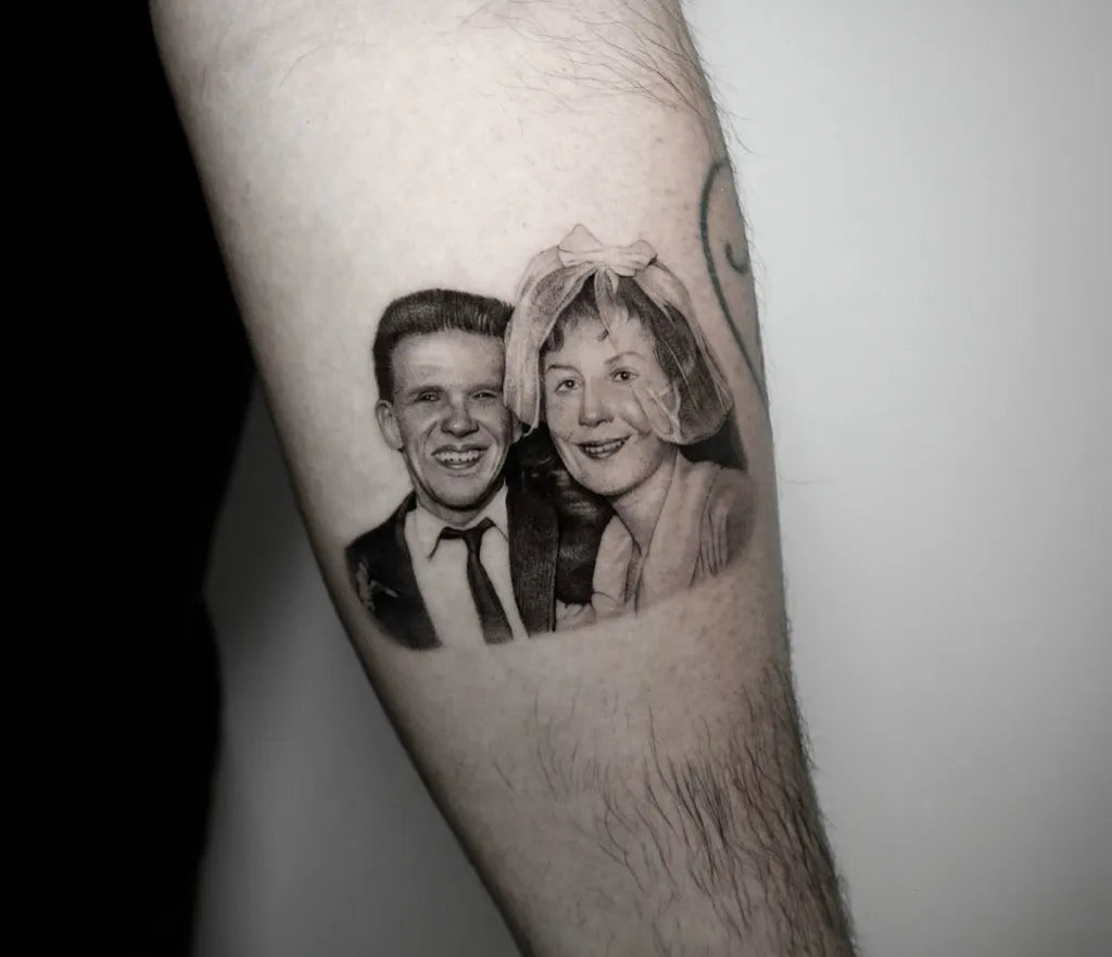 Medium Black and Grey Portrait Couple Family Tattoo on Men Arm by @cain__tt