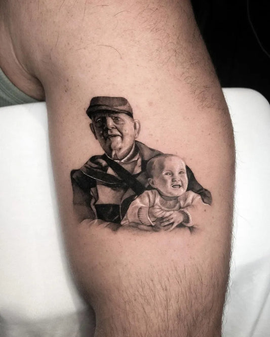 Medium Black and Grey Portrait of Man and Baby Family Tattoo on Men Arm by @fuhrichtattoo