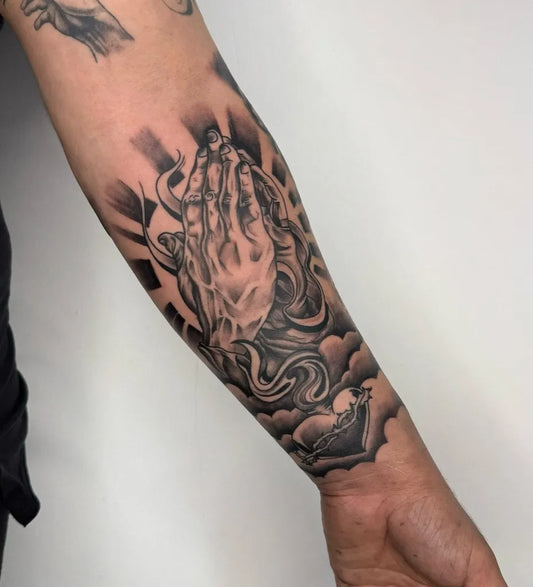 Medium Black and Grey Praying Hands Clouds Tattoo on Men Arm by @ersintattooer