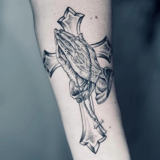 Medium Black and Grey Praying Hands Cross Rosary Tattoo on Women Arm by @supine_tattoo_and_art