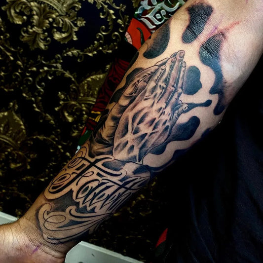 Medium Black and Grey Praying Hands Faith Tattoo on Men Arm by @bossd_tattoo