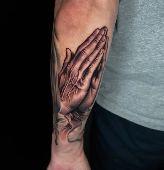 Medium Black and Grey Praying Hands Tattoo on Men Arm by @jaggum_the_dopest