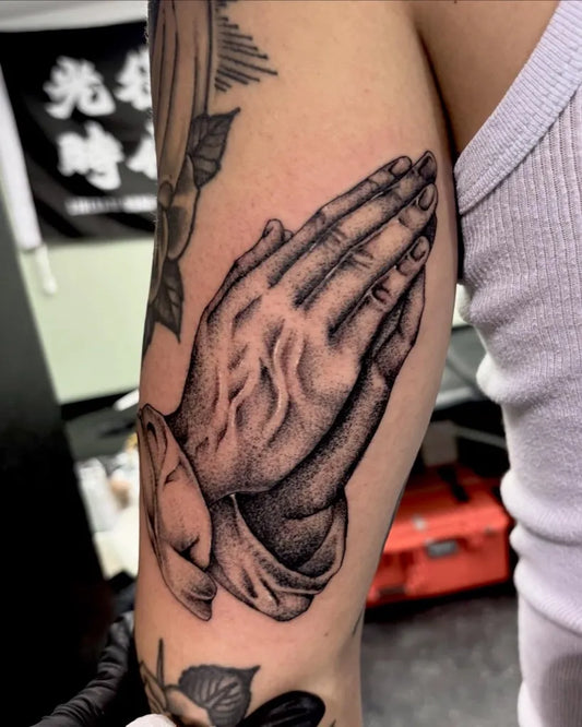Medium Black and Grey Praying Hands Tattoo on Men Arm by @marihposa