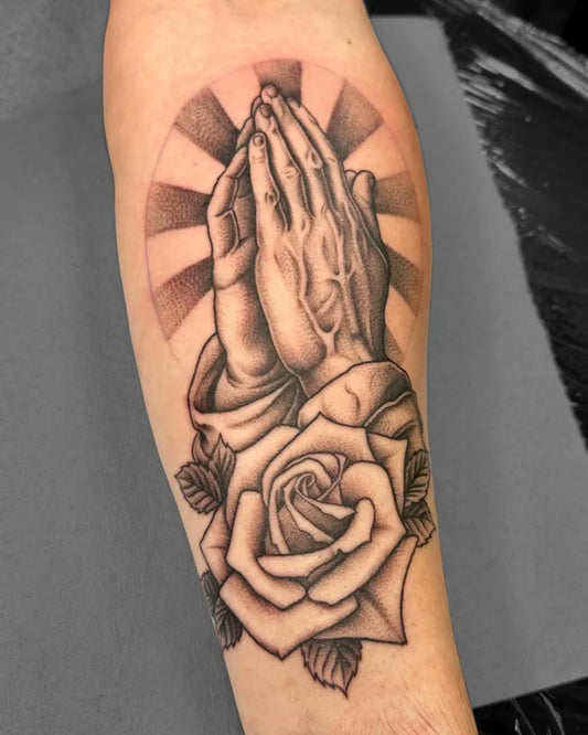 Medium Black and Grey Praying Hands and Rose Tattoo on Men Forearm by @stabbyabby_tattoos