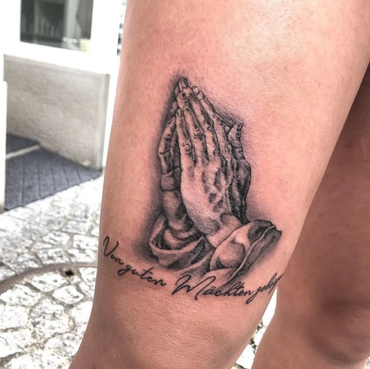 Medium Black and Grey Praying Hands with Banner Tattoo on Women Thigh by @raphael500_tattoo