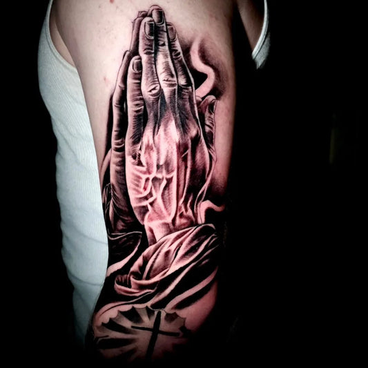 Medium Black and Grey Praying Hands with Cross Tattoo on Men Arm by @tattoosbygonzo530