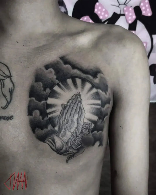 Medium Black and Grey Praying Hands with Rays and Clouds Tattoo on Men Chest by @juanlabao_tattoo