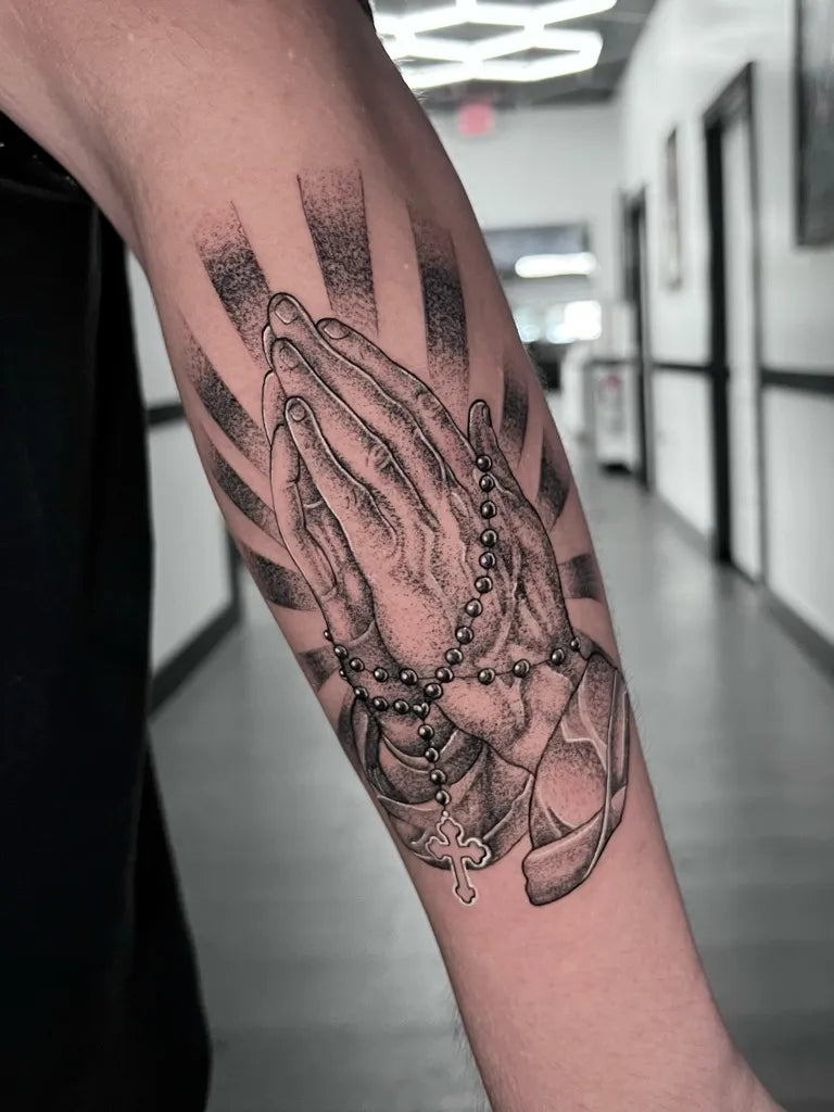 Medium Black and Grey Praying Hands with Rosary Tattoo on Men Arm by @inkedbypanezo
