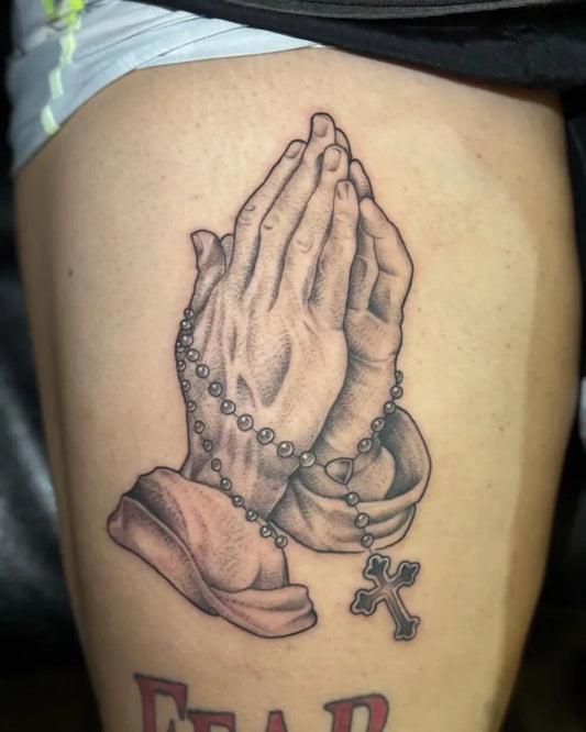 Medium Black and Grey Praying Hands with Rosary Tattoo on Men Thigh by @demi.ink