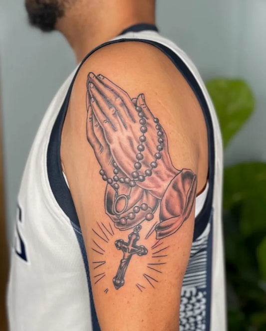 Medium Black and Grey Praying Hands with Rosary and Cross Tattoo on Men Arm by @montauktattoony