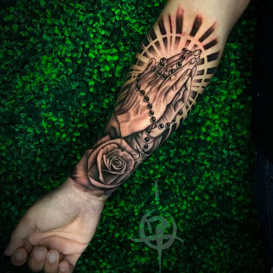 Medium Black and Grey Praying Hands with Rosary and Rose Tattoo on Men Arm by @_innovativeink