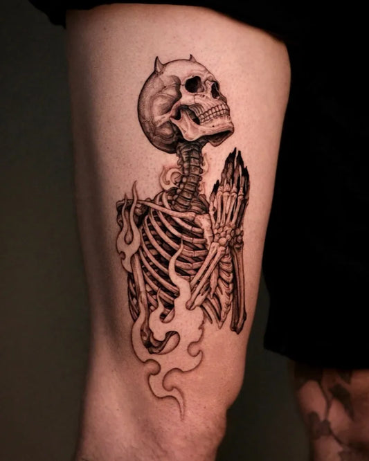 Medium Black and Grey Praying Skeleton with Flames Tattoo on Men Thigh by @amila.ink