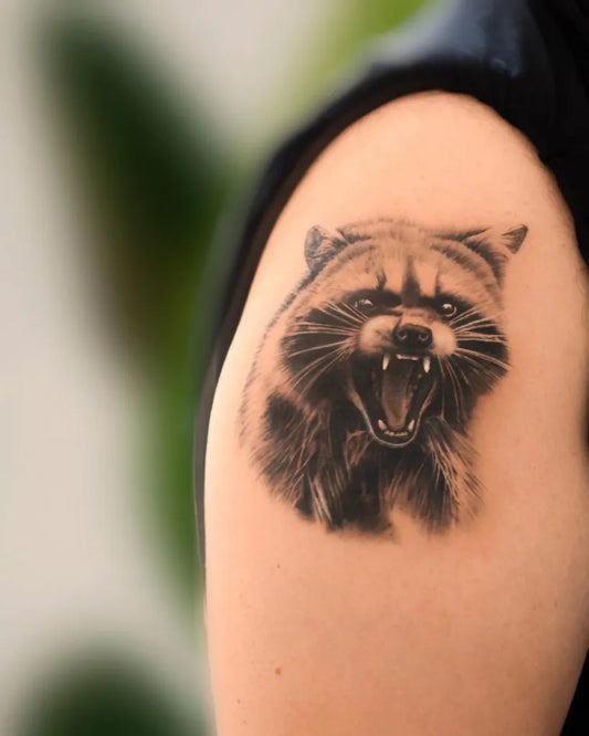 Medium Black and Grey Raccoon Tattoo on Men Upper Arm by @steff_ink