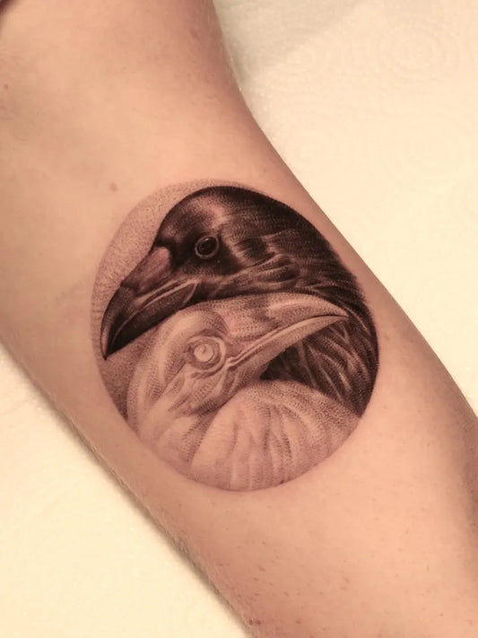 Medium Black and Grey Raven Yin Yang on Women Arm Tattoo by @eddie_dit