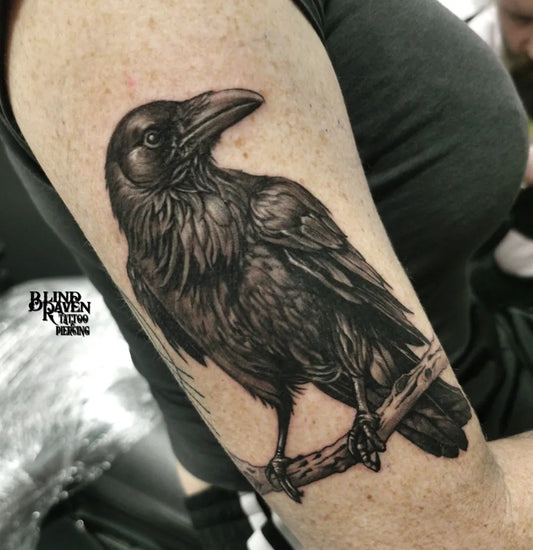 Medium Black and Grey Raven on branch on Women Arm Tattoo by @artbygoranfurjan