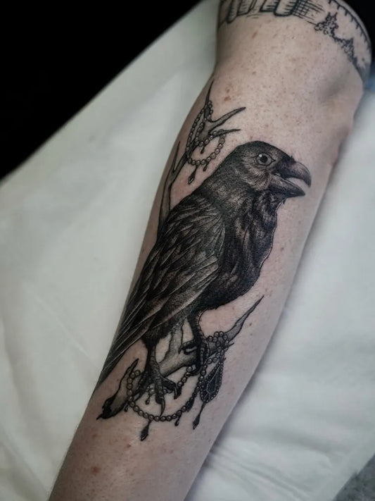 Medium Black and Grey Raven with Branch and Beads on Women Arm Tattoo by @revolver_rev