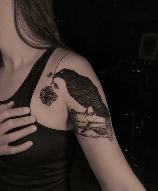 Medium Black and Grey Raven with Rose and Fence on Women Shoulder Tattoo by @avenntattoo