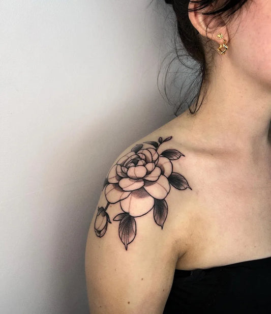 Medium Black and Grey Rose and Leaves Tattoo on Women Shoulder by @saretattoos