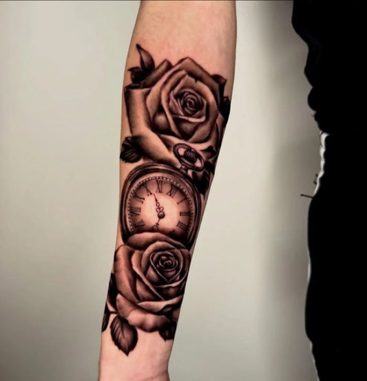 Medium Black and Grey Roses and Clock Tattoo on Men Arm by @oltre_tattoostudio