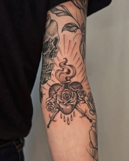 Medium Black and Grey Sacred Heart Skull and Roses Tattoo on Women Arm by @easytigerbrianna
