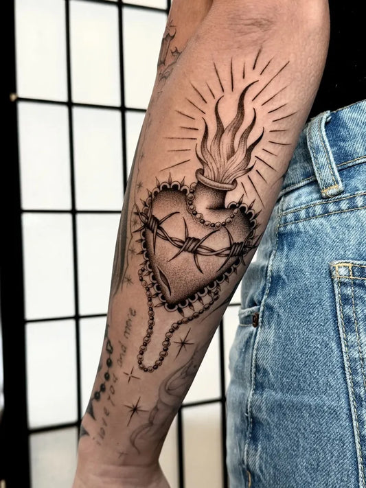 Medium Black and Grey Sacred Heart with Crown of Thorns Tattoo on Women Arm by @brisatattoos