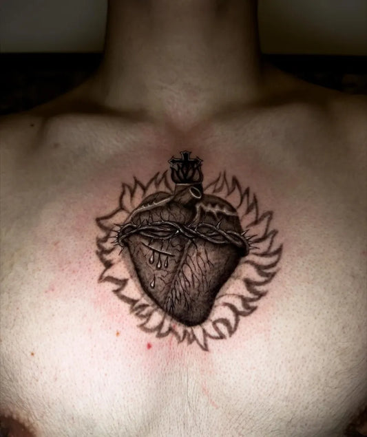 Medium Black and Grey Sacred Heart with Crown of Thorns and Flames Tattoo on Men Chest by @davidp_tattoos