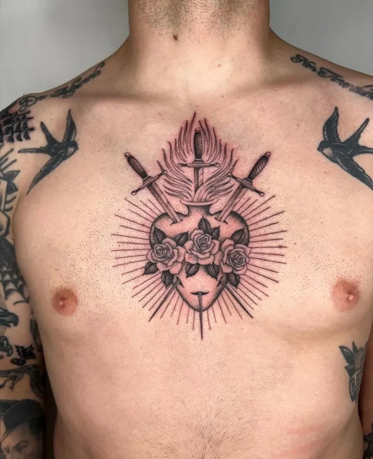 Medium Black and Grey Sacred Heart with Daggers and Roses Tattoo on Men Sternum by @kingsavetattoo