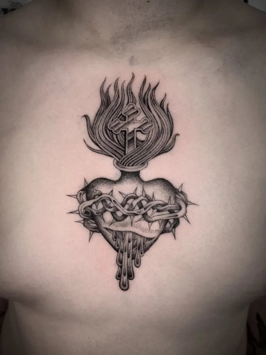 Medium Black and Grey Sacred Heart with Flames and Crown of Thorns Tattoo on Men Chest by @sonnyrohantattoo