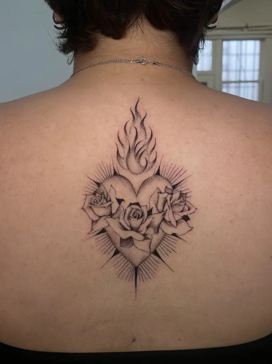 Medium Black and Grey Sacred Heart with Flames and Roses Tattoo on Women Back by @raybies.ink
