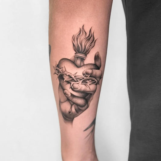 Medium Black and Grey Sacred Heart with Flames and Thorns Tattoo on Men Arm by @xray_tattoos