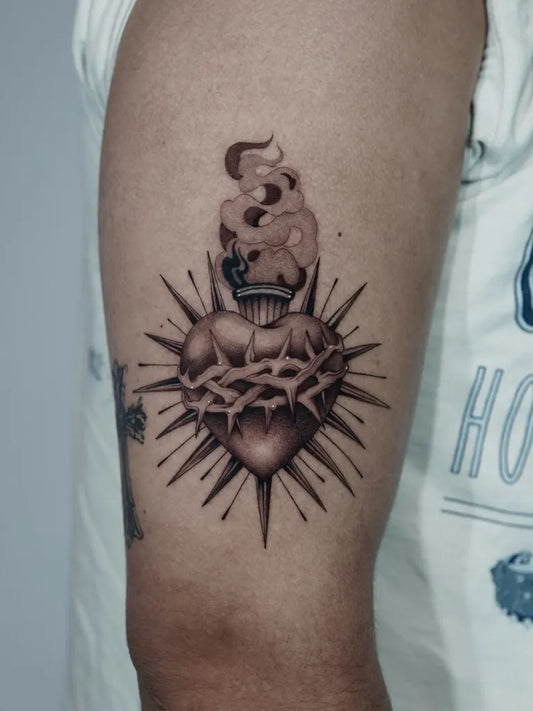Medium Black and Grey Sacred Heart with Thorns and Flames Tattoo on Men Arm by @ale_m.i.a