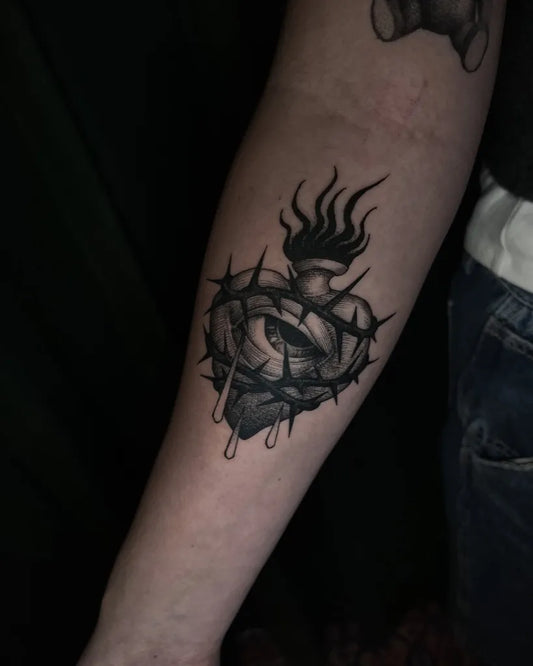 Medium Black and Grey Sacred Heart with Thorns and Flames Tattoo on Women Arm by @carney_cai