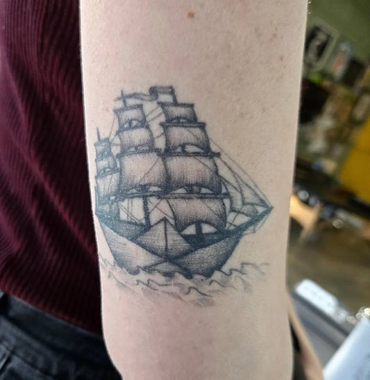 Medium Black and Grey Sailing Ship Nautical Tattoo on Women Arm by @amhinrichs