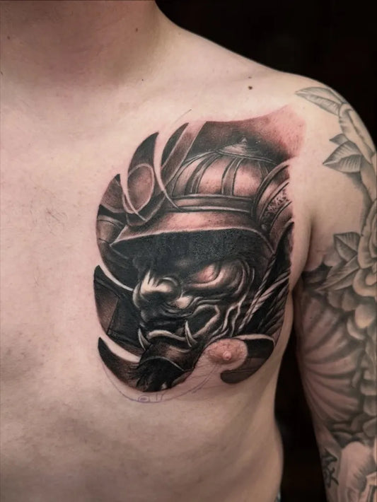 Medium Black and Grey Samurai Hannya Mask Tattoo on Men Chest by @japan.tattoo
