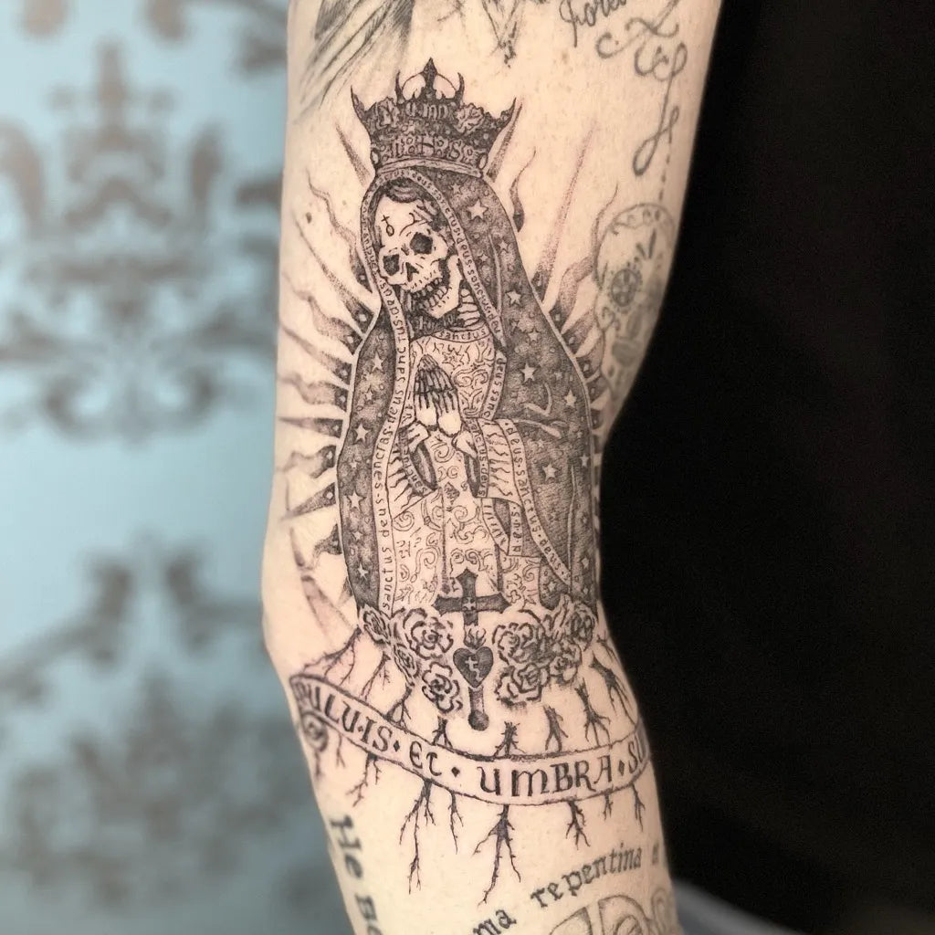 Medium Black and Grey Santa Muerte with Crown and Banner Tattoo on Women Arm by @icontattoomi