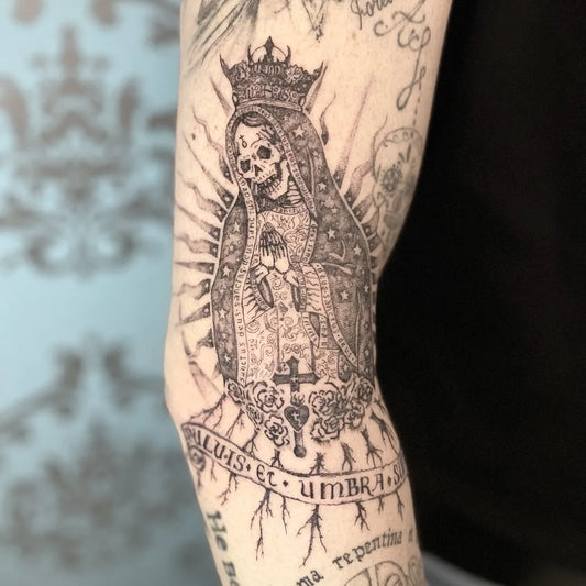 Medium Black and Grey Santa Muerte with Crown and Banner Tattoo on Women Arm by @icontattoomi