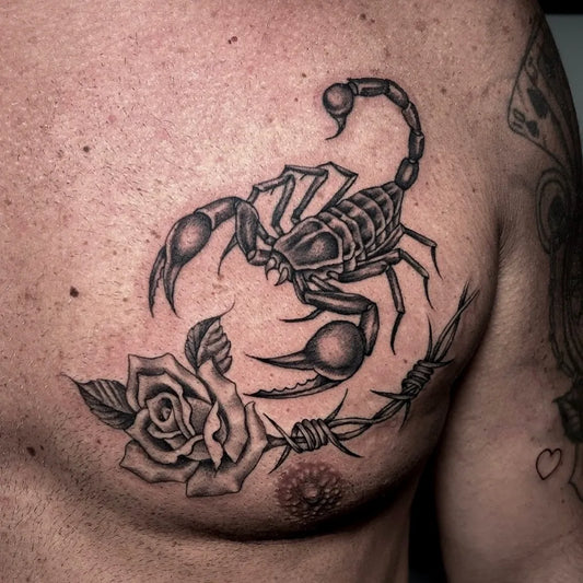 Medium Black and Grey Scorpion Rose Barbed Wire on Men Chest Tattoo by @simonelhaze