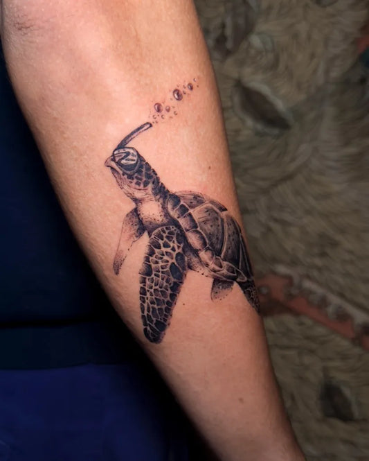 Medium Black and Grey Sea Turtle Bubbles Tattoo on Women Arm by @tian.tatu
