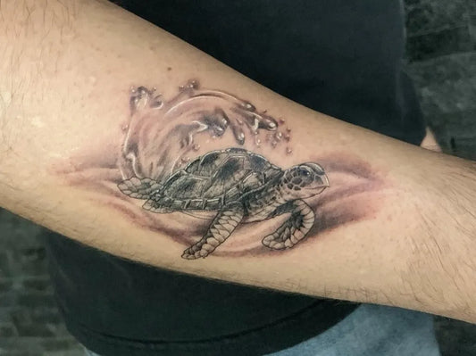 Medium Black and Grey Sea Turtle Tattoo on Men Arm by @halloweenink