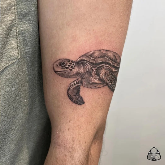 Medium Black and Grey Sea Turtle Tattoo on Men Arm by @sid_couto