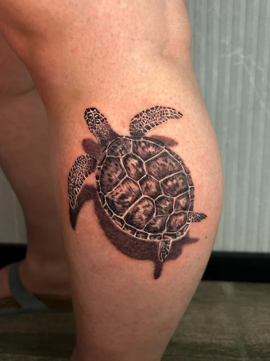 Medium Black and Grey Sea Turtle Tattoo on Men Leg by @guytxttoo