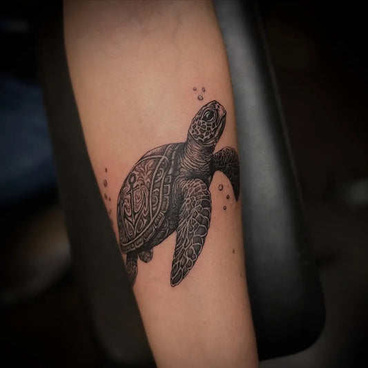 Medium Black and Grey Sea Turtle Tattoo on Women Arm by @evas.endless.art