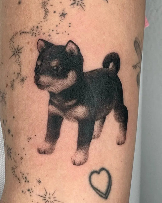 Medium Black and Grey Shiba Inu Dog with Stars and Heart Tattoo on Women Thigh by @hoerli.ink