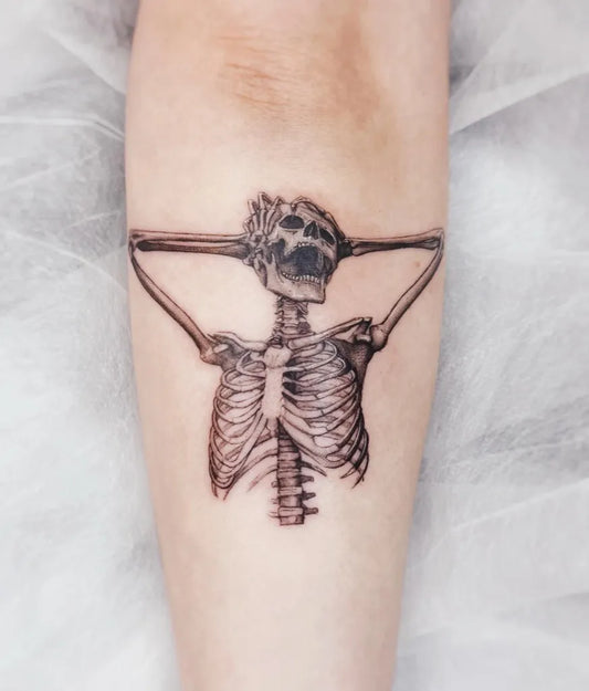 Medium Black and Grey Skeleton Headache Tattoo on Women Arm by @baronart_lucy