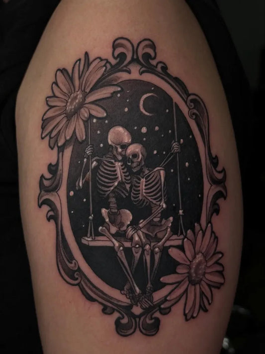 Medium Black and Grey Skeleton Swing with Daisies Tattoo on Women Arm by @tattoo.fairyyy
