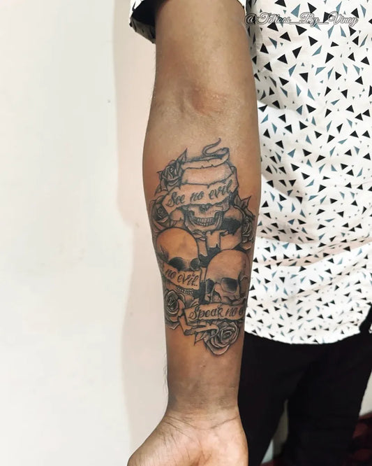 Medium Black and Grey Skull Banner Rose Tattoo on Men Inner Arm by @vinay_dut