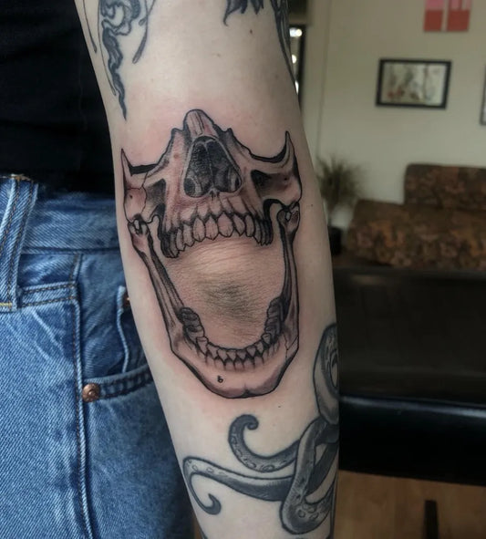Medium Black and Grey Skull Tattoo on Women Elbow by @shannon_mcfarlane